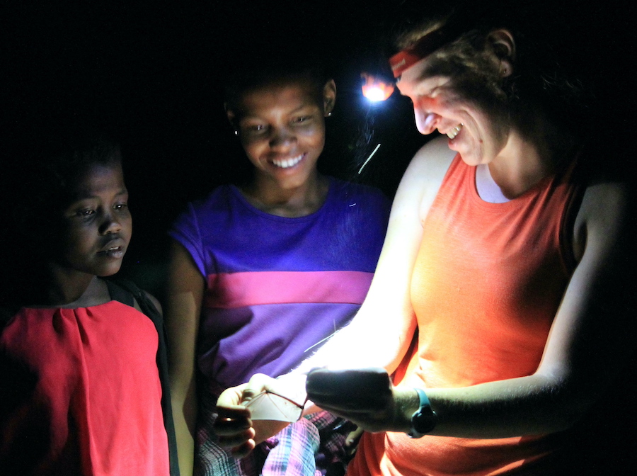 Showing a bat to young girls in northwestern Namibia